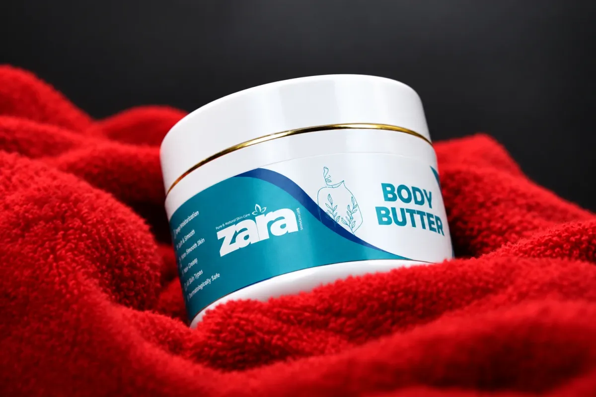A jar of Zara Body Butter on red cloth
